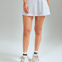 Mini length hem tennis skirts. Lightweight, breathable and comfortable. Featuring built in shorts and pockets for storage. White & Classic Tennis Skirt.